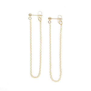 Pair of gold earrings, long loop of delicate chain on a post.