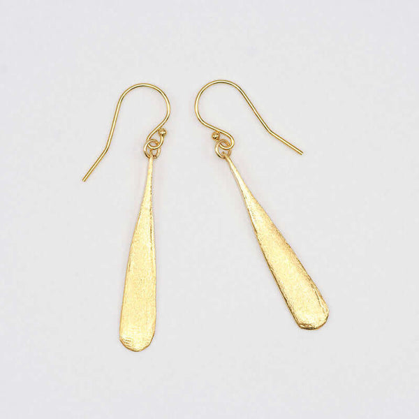 Pair of gold earrings shaped like elongated teardrop.