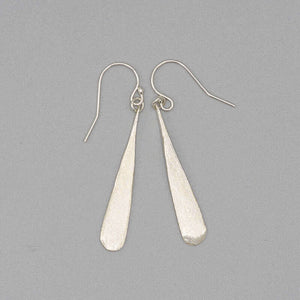 Pair of silver earrings shaped like elongated teardrop.