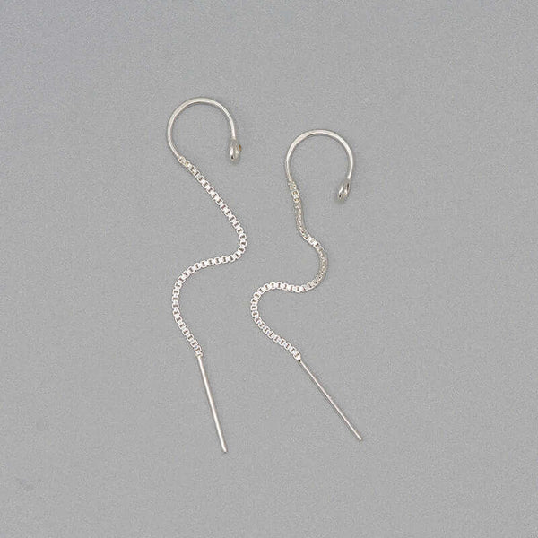 Pair of silver earrings, with open hoop with thin chain hanging down.