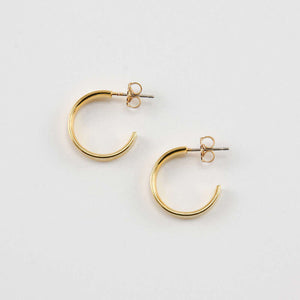 Pair of gold open hoop earrings on posts.