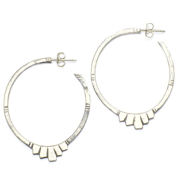 Pair of silver geometric native motif hoop earrings.