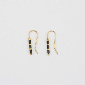Pair of small gold wire earrings with black and gold beads.