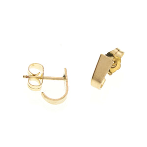Pair of tiny gold post cuff earrings that wrap around earlobe.