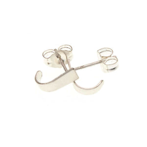Pair of tiny silver post cuff earrings that wrap around earlobe.