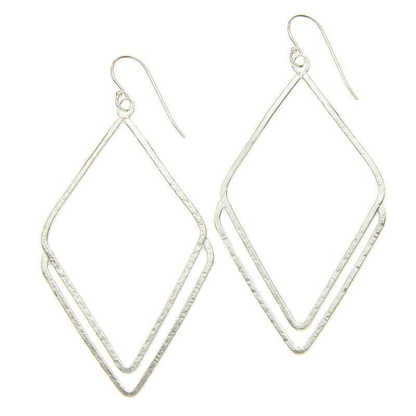 Pair of silver rhombus shaped earrings.