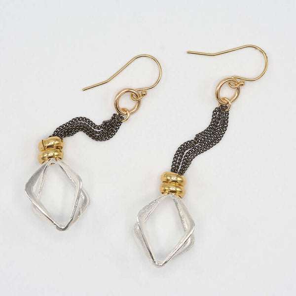 Pair of dark chain dangle earrings with cast silver rhombus.