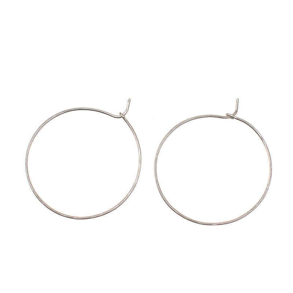 Pair of simple silver hoop earrings with loop and hook as clasp.