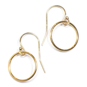 Pair of gold circle earrings on earwire.