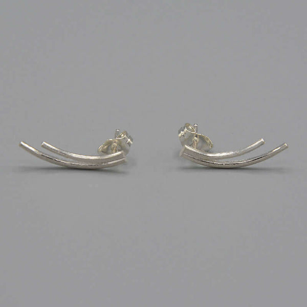 Pair of silver earrings of 2 curved swoops on posts.