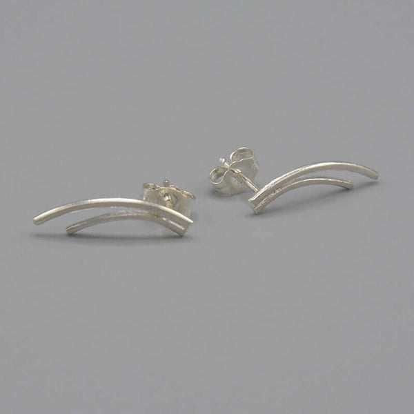 Pair of silver earrings of 2 curved swoops on posts.