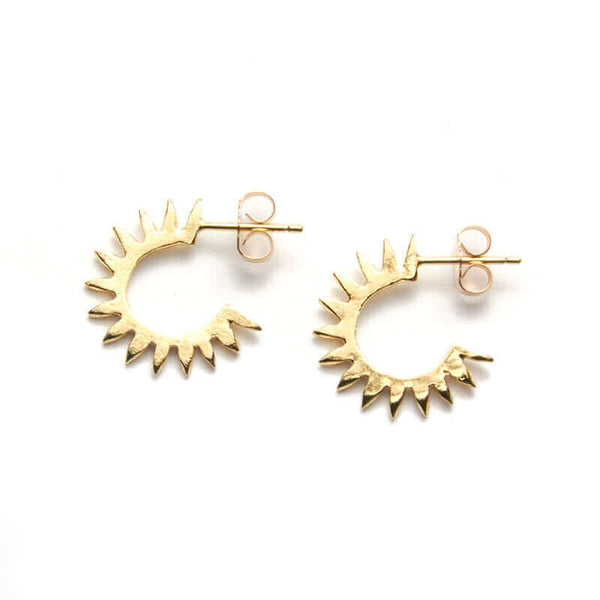 Pair of cast curved spiky gold earrings on posts.