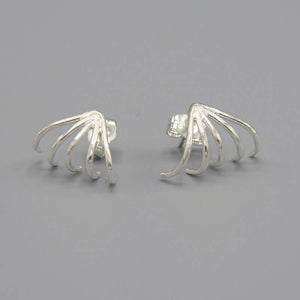 Pair of silver earrings with 5 gold wires that wrap around earlobes.