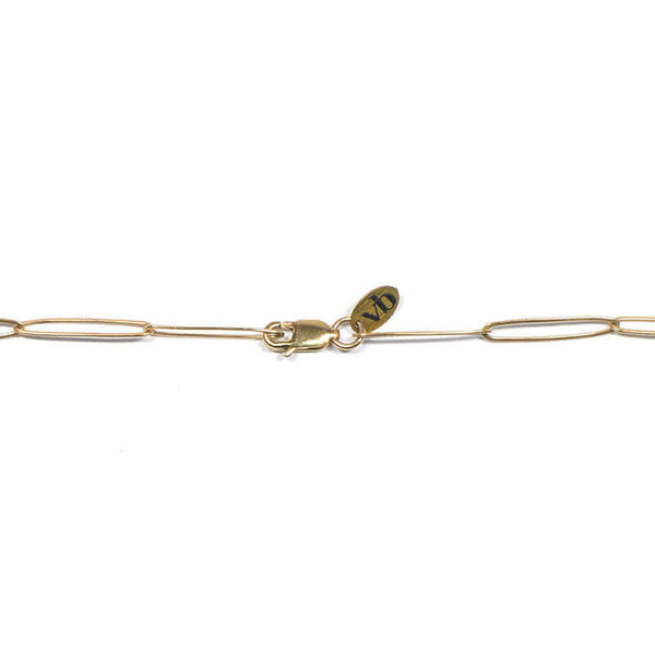 Clasp detail of gold elongated link necklace with clean modern design.