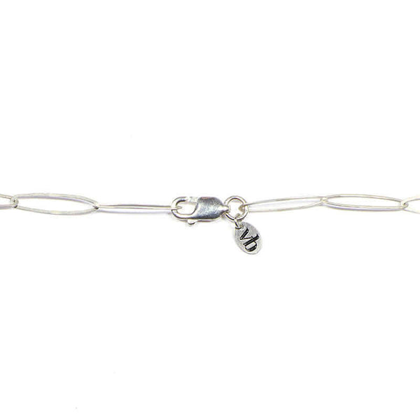 Clasp detail of silver elongated link necklace with clean modern design.