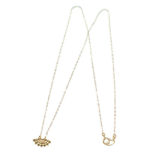 Gold necklace with fan-shaped lace pattern pendant, inset with small diamond.