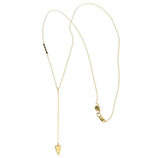Gold necklace, long arrow pendant, chain with black bead accents, full length showing clasp.
