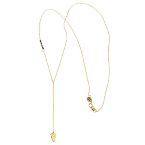 Gold necklace, long arrow pendant, chain with black bead accents, full length showing clasp.