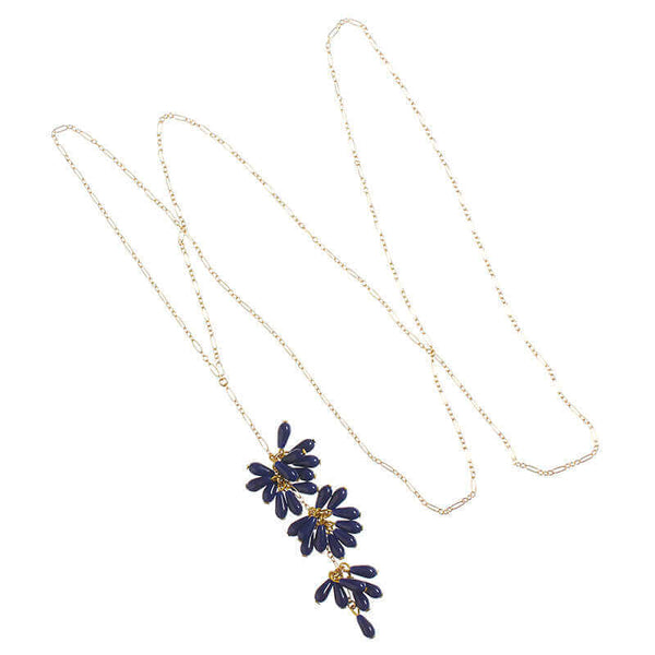 Delicate gold chain necklace with drop pendant of 3 bunches of dark blue beads with single bead at end.
