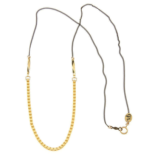 Necklace with black upper chain and gold box chain on the bottom, full length showing clasp.