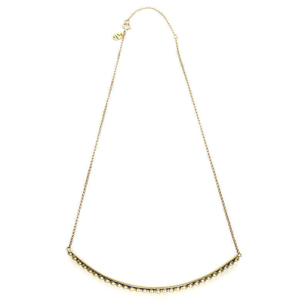 Gold chain necklace with beaded curved bar at bottom, shown full length.