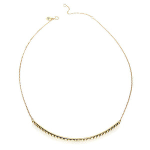 Gold chain necklace with beaded curved bar at bottom, shown full length.