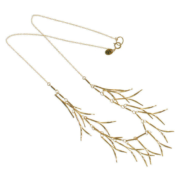 Delicate gold necklace with curved hanging frill design, shown full length.