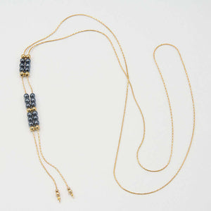 Gold chain necklace with pendant of double rows of dark pearls and gold beads, that slide to adjust length.