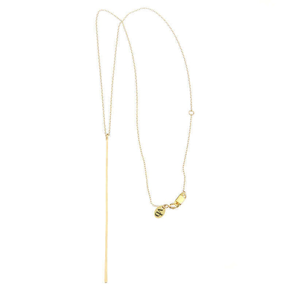 Gold chain necklace with long flattened wire pendant.