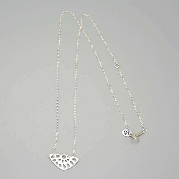 Delicate silver chain necklace with lotus root motif pendant.