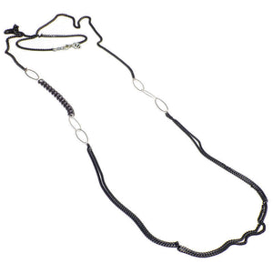 Long black oxidized silver multi-chain necklace with silver link details along chain.