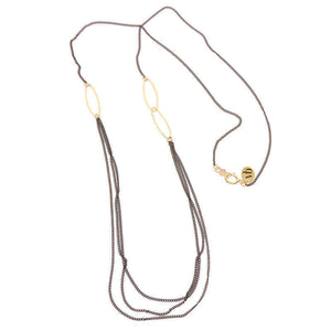 Short black oxidized silver multi-chain necklace with gold link details along chain.