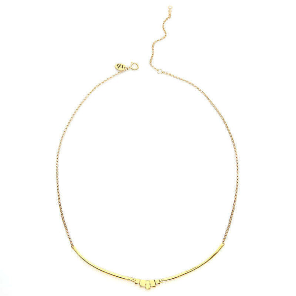 Gold necklace with curved bar pendant with geometric native motif.
