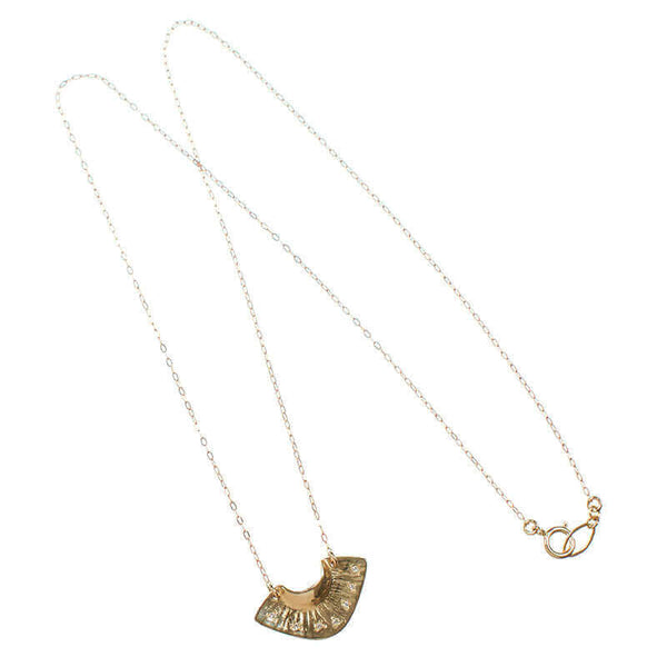 Dainty gold necklace with fan shaped pendant with tiny diamonds.