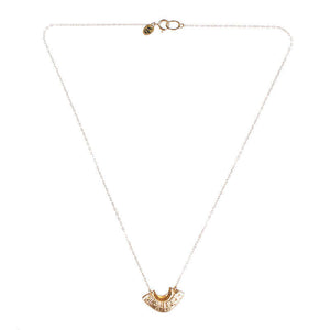 Dainty gold necklace with fan shaped pendant.