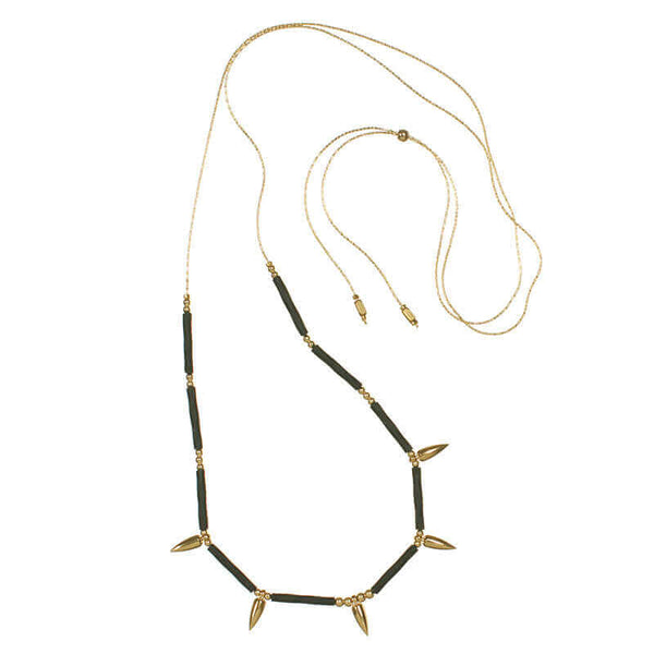 Gold necklace with spiral black tubes and gold beads with 5 gold spikes, showing slider clasp.
