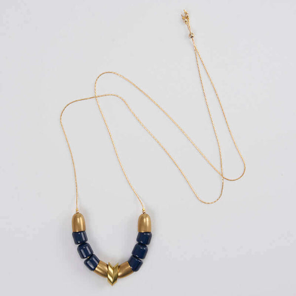 Gold necklace with brass cups, links, and blue beads as pendant.