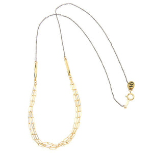 Black chain necklace with 3 delicate elongated link chains at the front.