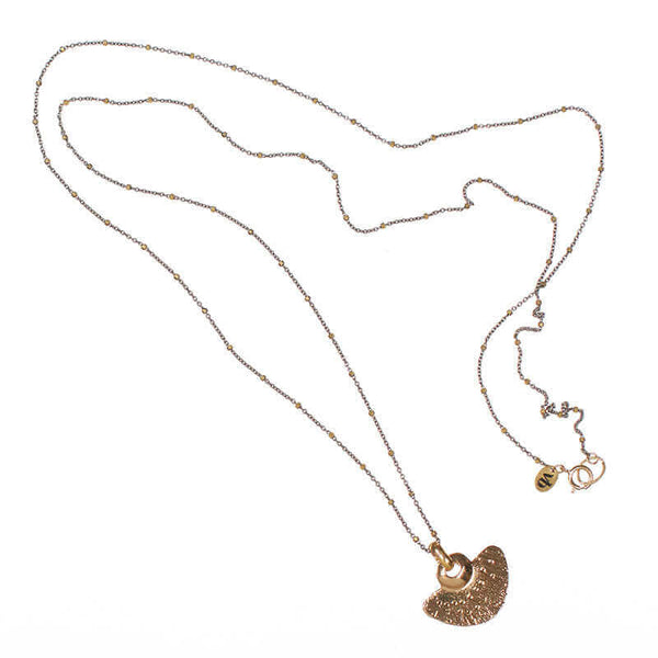 Delicate dark chain necklace with tiny gold beads along chain and gold half-circle shaped pendant.