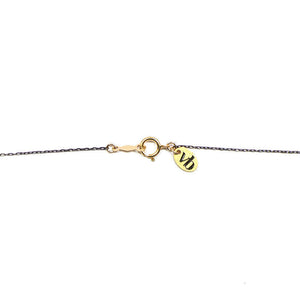 Close-up of black oxidized chain necklace showing clasp detail.