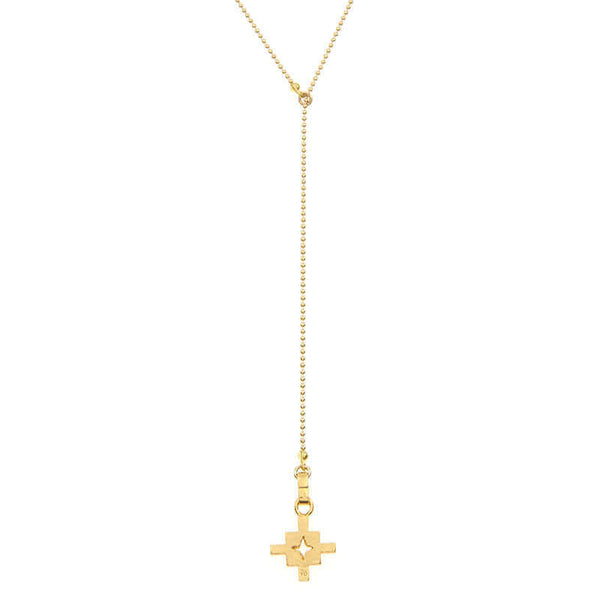 Close-up of gold bead chain necklace with small geometric cross shaped pendant and slider.