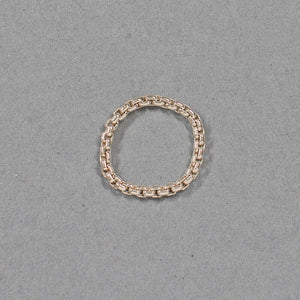 Thick silver chain ring on gray background.